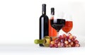 Wineglass, bottles of wine and grapes Royalty Free Stock Photo