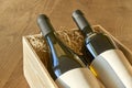 Bottles of wine in wooden gift box with copy space Royalty Free Stock Photo