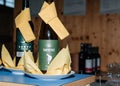 Bottles of wine with yellow napkin decor on display in rustic setting Royalty Free Stock Photo