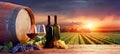 Bottles And Wineglasses With Grapes And Barrel Royalty Free Stock Photo