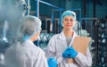 Bottling factory worker inspecting quality of water bottles before shipment. Reverse osmosis system used in plant. water Royalty Free Stock Photo