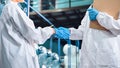 Bottling factory worker inspecting quality of water bottles before shipment. Reverse osmosis system used in plant. water Royalty Free Stock Photo