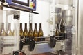 Bottling and sealing conveyor line at winery factory Royalty Free Stock Photo