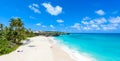 Bottom Bay, Barbados - Paradise beach on the Caribbean island of Barbados. Tropical coast with palms hanging over turquoise sea. Royalty Free Stock Photo