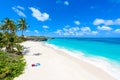 Bottom Bay, Barbados - Paradise beach on the Caribbean island of Barbados. Tropical coast with palms hanging over turquoise sea. Royalty Free Stock Photo