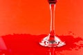 Bottom of glass cup with some red wine spill over Royalty Free Stock Photo