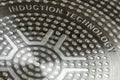 Bottom of induction cookware. Texture of a non-stick induction pan close-up Royalty Free Stock Photo