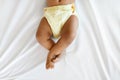 Bottom Part Of Black Infant Baby Wearing Reusable Diaper Lying On Bed Royalty Free Stock Photo