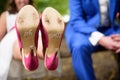 Bottom of the pink shoes of the bride