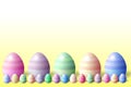 Bottom row of 3d pastel colored easter eggs yellow background and 5 big eggs illustration Royalty Free Stock Photo