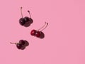 Bottom shaped cherries on bright pink background Royalty Free Stock Photo