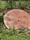 the bottom sideof a rusty metal round white picnic table Royalty Free Stock Photo