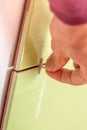 Bottom spacers being used by a tiler while tiling a wall Royalty Free Stock Photo