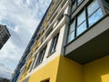 Bottom up corner view of a tall large house of a new building against a background of blue sky Royalty Free Stock Photo