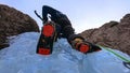 BOTTOM UP: Extreme ice climber stands in the cracks of glassy frozen waterfall.