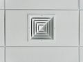 Bottom-up view of the ceiling socket of a cooling and heating system ventilation duct for large rooms installed on a suspended Royalty Free Stock Photo