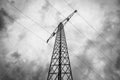 Bottom up view of an electricity pylon with high voltage power lines Royalty Free Stock Photo