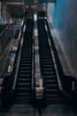Bottom-up view of an empty escalator underground. Empty stair steps of a new escalator in the subway. Two escalator Royalty Free Stock Photo
