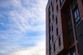 Bottom up view on new modern residential buildings made of red and yellow brick. Medium-rise residential building. Royalty Free Stock Photo