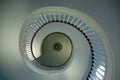 Bottom up view of symmetrical spiral staircase in old building. Royalty Free Stock Photo