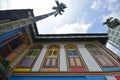 Bottom up view of Tan Teng Niah Residence with tall palm tree