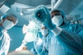 bottom view of african american anesthetist holding oxygen mask