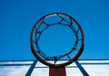 Bottom view of a basketball hoop with a metal net against Royalty Free Stock Photo