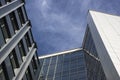 Bottom view of a beautiful tall modern office building against the sky Royalty Free Stock Photo