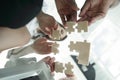 Bottom view. business team folding puzzle pieces. . Royalty Free Stock Photo