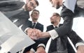 bottom view.businessmen shaking hands at the negotiating table