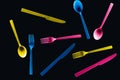 Bottom view of colorful plastic cutlery isolated on black. Royalty Free Stock Photo