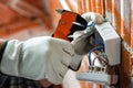 Electrician at work on a residential electrical system. Electricity Royalty Free Stock Photo