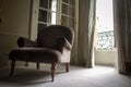 Bottom view of an elegant gray armchair over a window with shutters in a historic apartment on Place Vendome in Paris