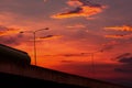 Bottom view of elevated concrete highway with sunset sky. Overpass concrete road. Road flyover structure. Modern motorway. Royalty Free Stock Photo