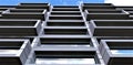 A bottom view of the exclusive faÃÂ§ade of a luxury apartment building finished with laminated mineral wool composite. 3d rendering Royalty Free Stock Photo