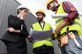 bottom view of female engineer and male workers with blueprints Royalty Free Stock Photo