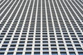 Bottom view glass grey square Windows of modern city business building skyscraper. Receding perspective, movement forward and up. Royalty Free Stock Photo