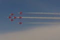 Bottom view of group of airplanes in the blue sky.