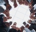 Group of diverse ambitious young people standing in a circle Royalty Free Stock Photo