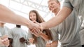 Handshake of young people in a circle of friends Royalty Free Stock Photo