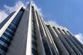 Bottom view of high-rise buildings in a big city against a blue sky. Royalty Free Stock Photo