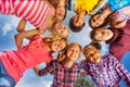 Bottom view of kids group standing in round shape