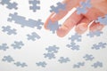 Bottom View. Male Hands Assembling Jigsaw Puzzle. Pastime, a hobby. Complex project management. Playing Calm Board Game Royalty Free Stock Photo