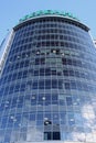 A bottom view of the mirrored building of processing center of Sberbank head office on the background of cloudy sky in Novosibirsk