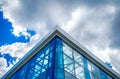 Bottom view of modern glass blue business centre architecture.