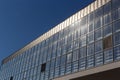 Bottom view of a modern skyscraper building with glass window against sky background for promotional content. Contemporary Royalty Free Stock Photo