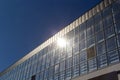 Bottom view of a modern skyscraper building with glass window against sky background for promotional content. Contemporary Royalty Free Stock Photo