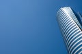 Bottom view of modern skyscrapers in business district against blue sky Royalty Free Stock Photo