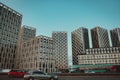 Bottom view of modern skyscrapers in business district against blue sky. Looking up at business buildings, moving Royalty Free Stock Photo