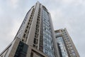 Bottom view of modern skyscrapers in business district against blue sky Royalty Free Stock Photo